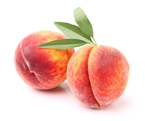 Ripe peaches with leaves
