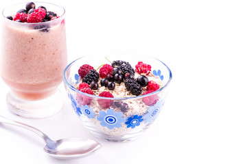 Oat flake porridge with fresh berries isolated