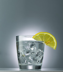 mineral water with ice and lemon close up
