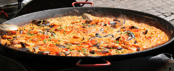 A Large Pan of Street Food Paella Being Cooked.