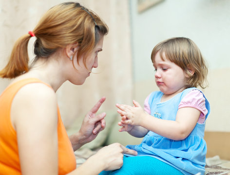 Woman berates baby in home