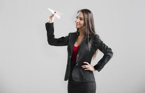 Woman Throwing A Paper Plane