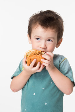 Boy Eating A Burger