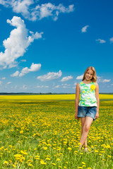 Girl in the dandelion field
