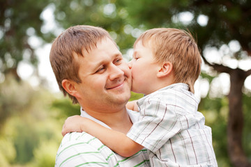 Happy father and son outdoors