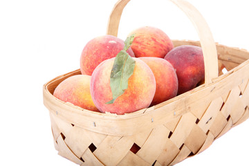 Basekt of Peaches on White
