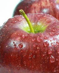water drop on red apple surface