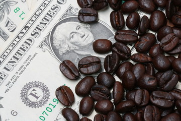 background of dollar bills and coffee beans