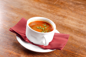 Delicious soup in white dish