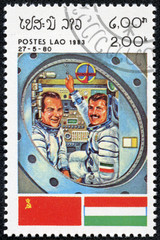stamp printed by Laos, shows astronaut