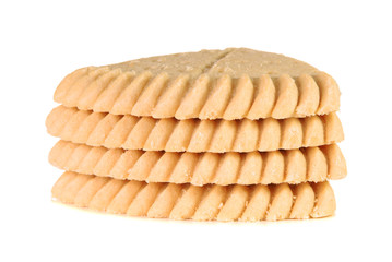 Stack of four pieces of shortbread over white background