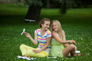 girls launch paper airplanes