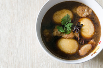Pork stew with eggs in bowl
