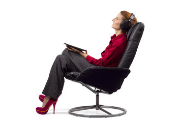 Woman listening to audio books on a tablet © Innovated Captures