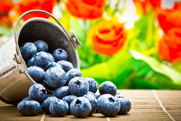 Delicious fruit berries in metal small pail
