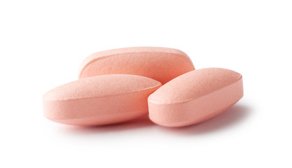 Obraz na płótnie Canvas Three pink pills