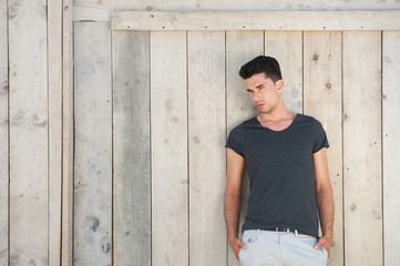 Casual young man standing outdoors