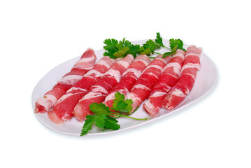 Pork rolls with parsley on white background