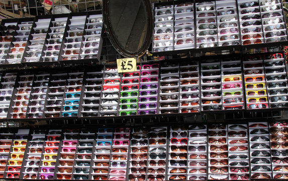 A Display Of Sunglasses On A Market Stall.