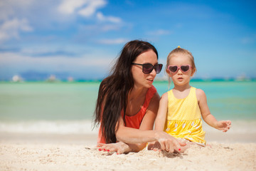 Fototapeta premium Young mother and her little daughter enjoying summer vacation