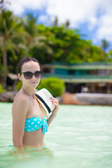 Young woman relaxing in the water at the sea