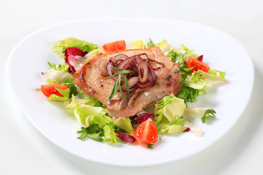 Pork chop with green salad