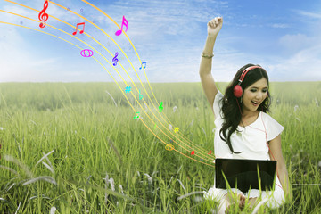 Happy woman singing on field
