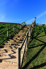 stairs to the beach with wooden railings