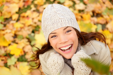 Autumn woman happy with colorful fall leaves