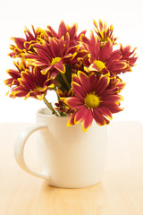 Flower bouquet in a white mug