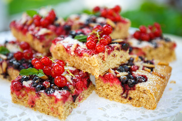 Fresh baked red and black currant berries cake
