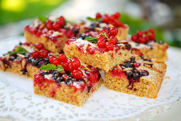 Fresh baked red and black currant berries cake