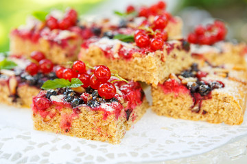 Fresh baked red and black currant berries cake