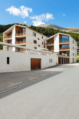 Fototapeta na wymiar mountain apartment building, view from the road