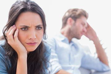 Stressed woman holding her head