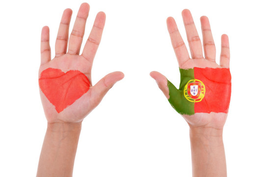 Hands with a painted heart and portuguese flag, i love portugal