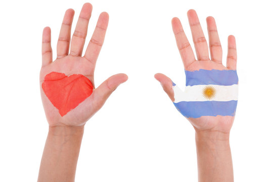 Hands with a painted heart and argentinian flag, i love argentin