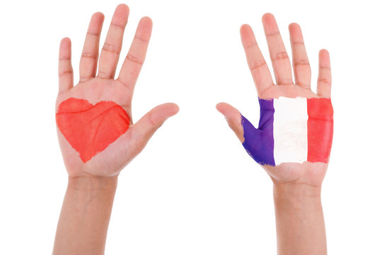 Hands with a painted heart and french flag, i love france concep