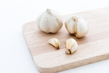 Garlic on Chopping block wood and isolated