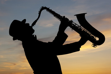 Saxophonist at sunset