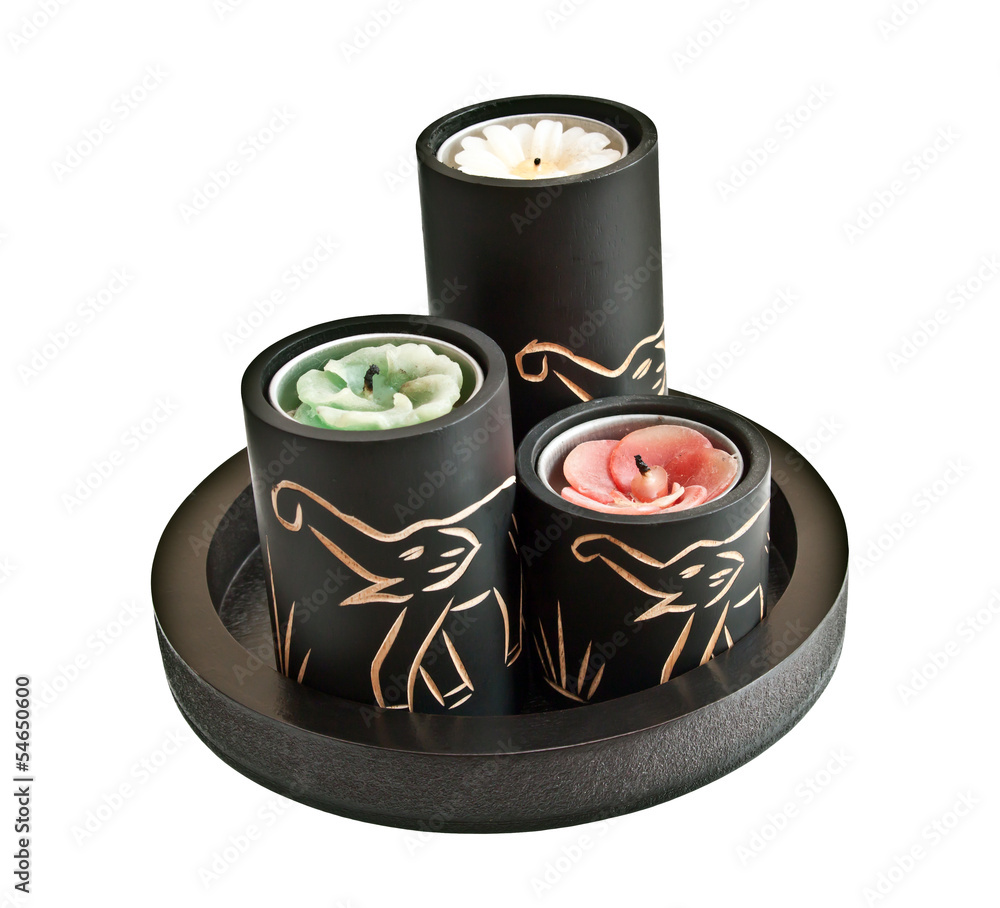 Wall mural Candles with carved elephants on them - souvenir from Asia or Af