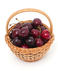 sweet cherry in a basket over white