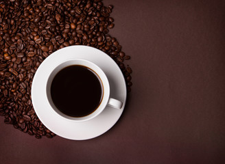 The cup of coffee and beans