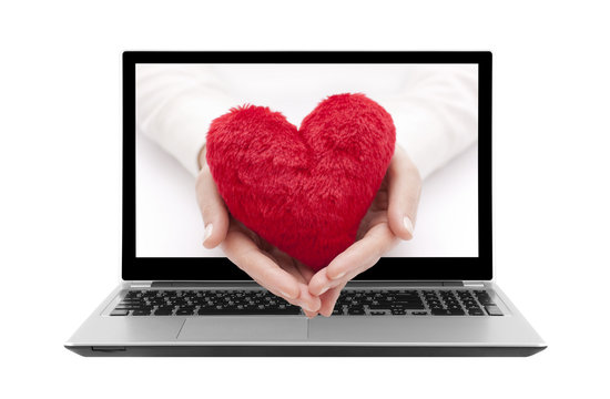 Laptop With Red Heart In Woman Hands. Clipping Path Included.