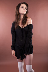 Beautiful girl on brown background studio shot