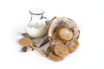 Milk jar and Finnish cookies on white background
