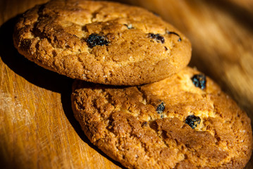 two oatmeal cookies on wood