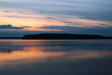 Fototapeta na wymiar Summer night twilight with water reflections