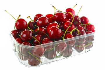 Fresh cherries in plastic box, isolated on white