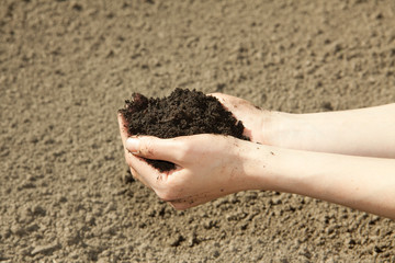hands with soil